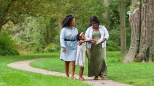 A mother and her daughters explore the grounds of Ford House.