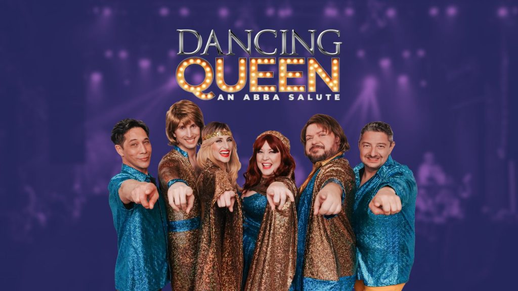 Promotional image for “Dancing Queen: An ABBA Salute” featuring six performers in glittering 1970s-style costumes pointing toward the camera. Bold retro lettering above reads “Dancing Queen: An ABBA Salute” on a purple stage-lit background.